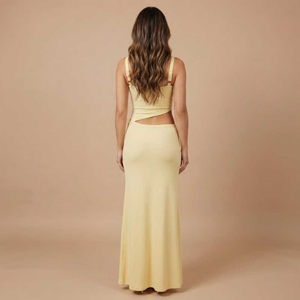 Back view of pale yellow cutout maxi dress with square neckline and waist opening