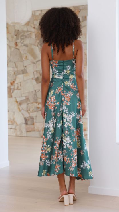 Back view of green floral midi dress showing spaghetti straps