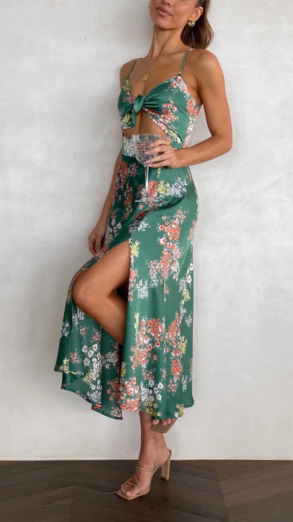 Green floral midi dress with front tie cutout and flowing skirt