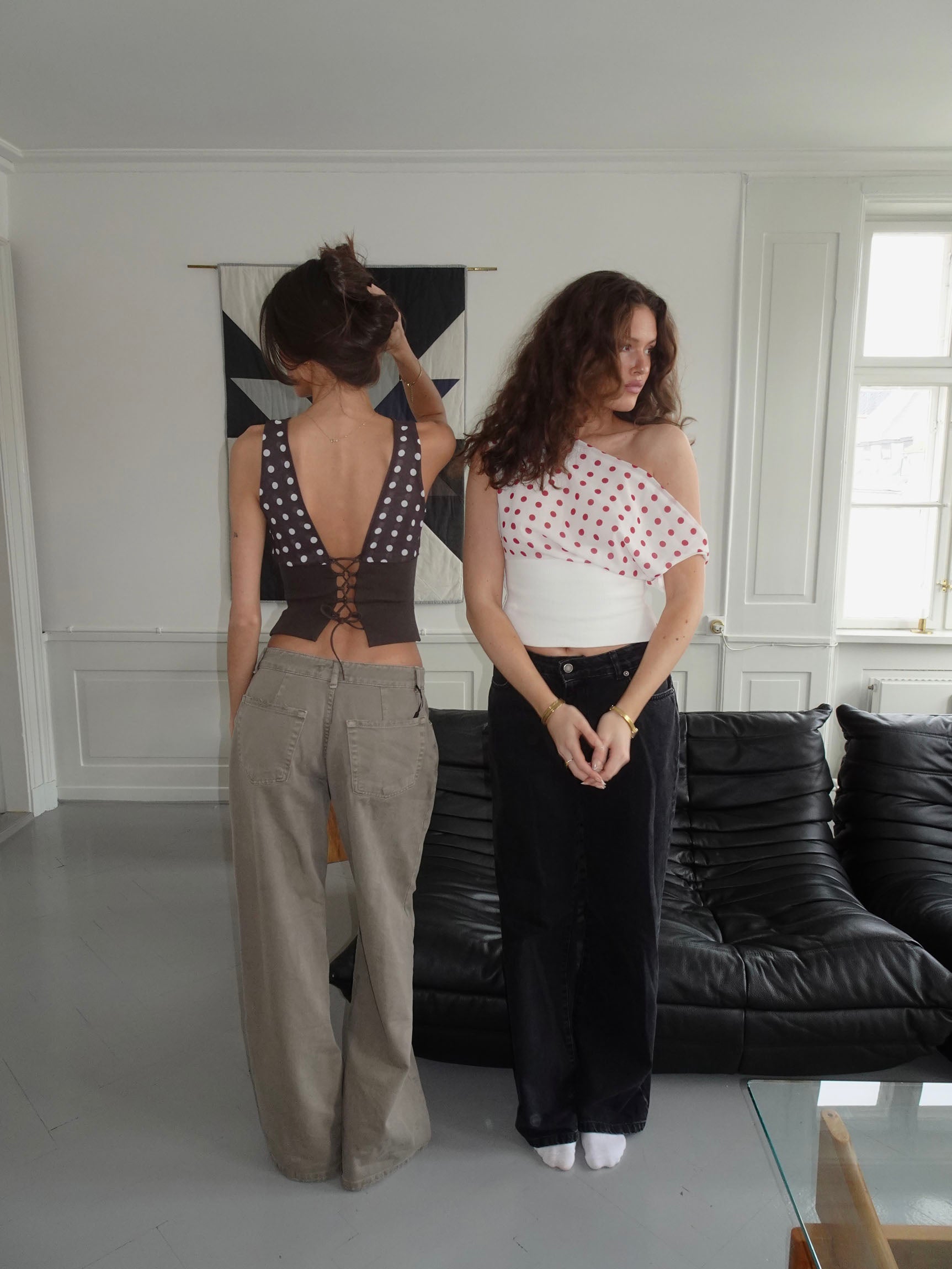 Red polka dot crop top with white ribbed waist and draped overlay