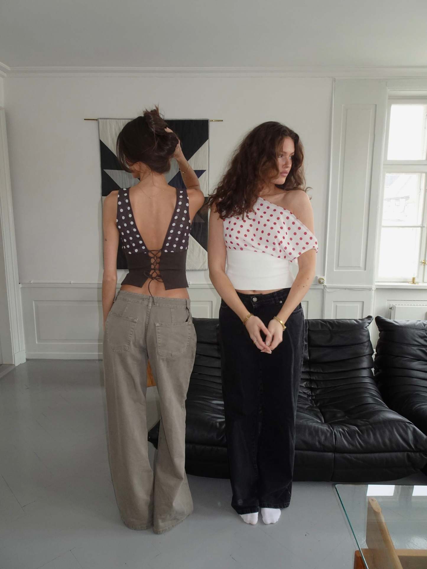 Red polka dot crop top with white ribbed waist and draped overlay