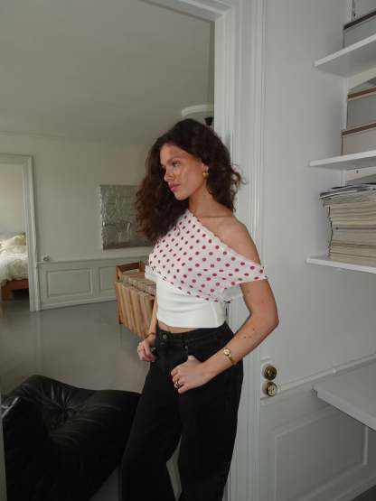 White and red polka dot crop top with draped shoulder design