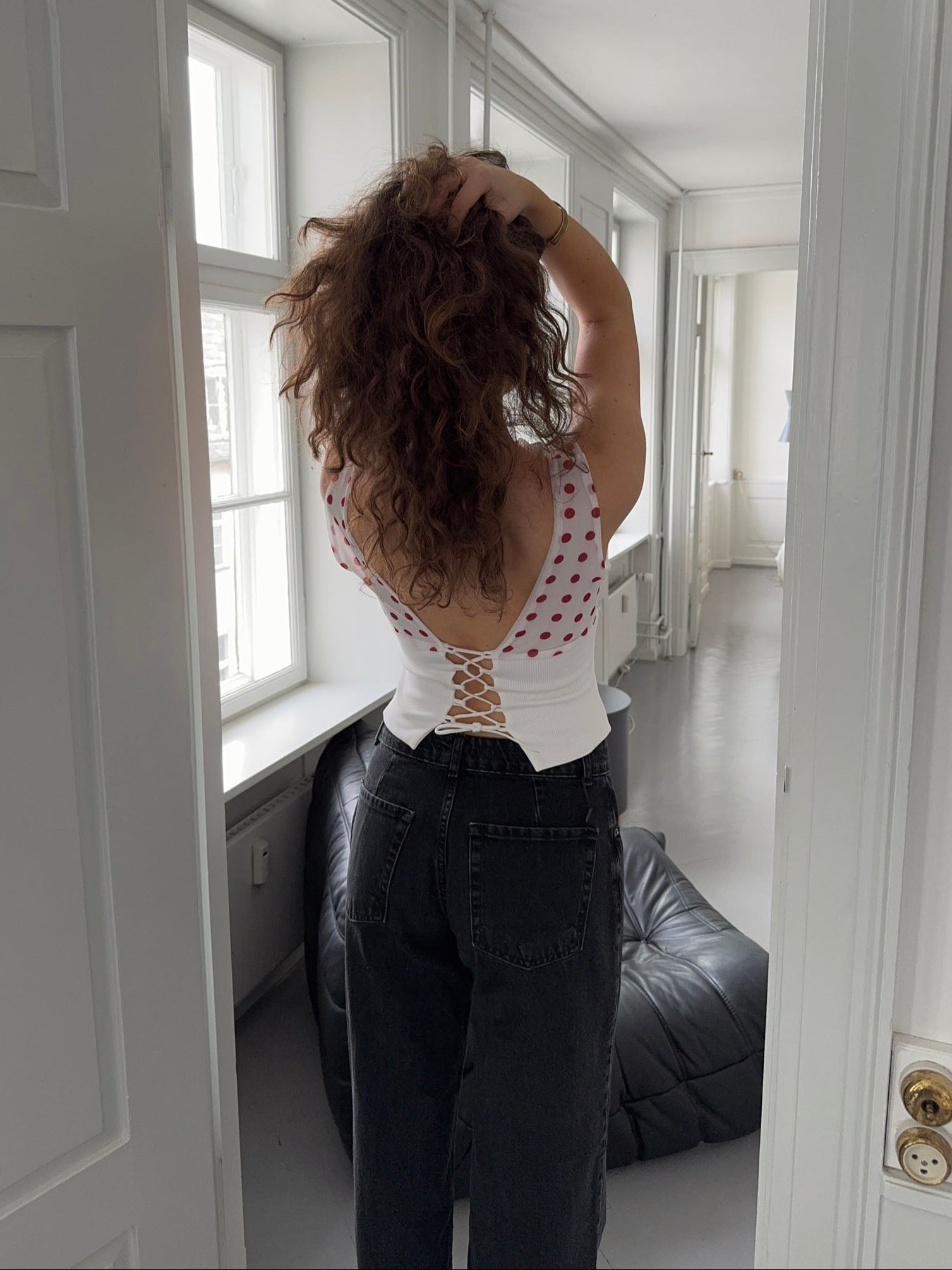Red polka dot draped crop top with white ribbed trim and off-shoulder design