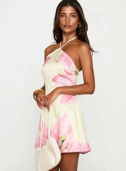 Side view of cream floral mini dress showing fitted bodice and above-knee hemline