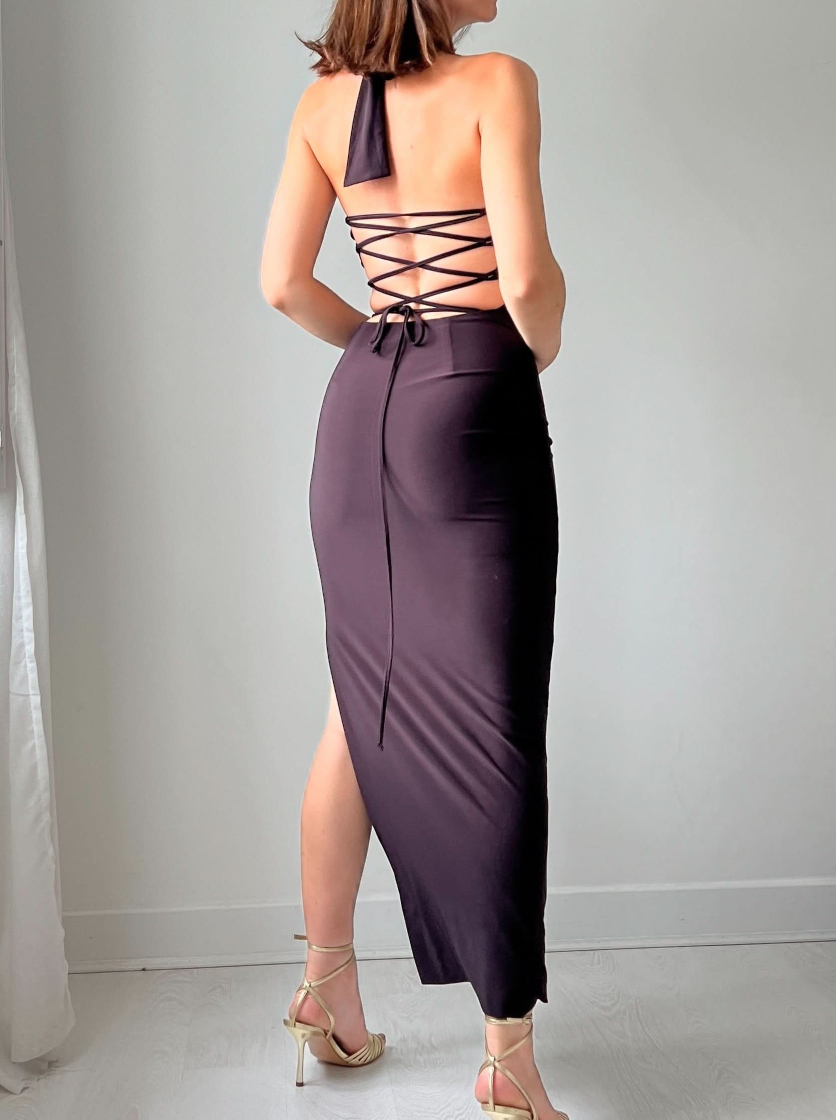 Back view of halter maxi dress with crisscross lace-up back and high slit