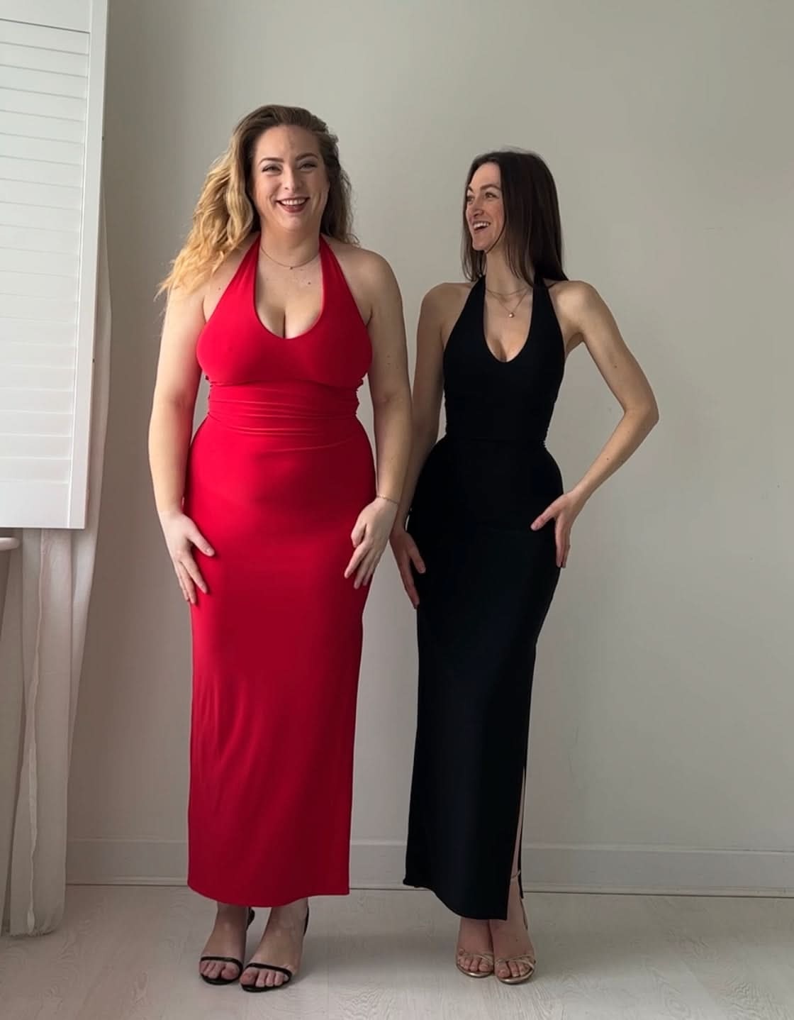 Red and black halter maxi dresses shown together in two colors