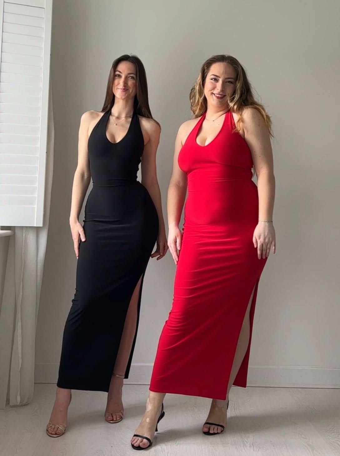 Black and red halter maxi dresses styled together side by side