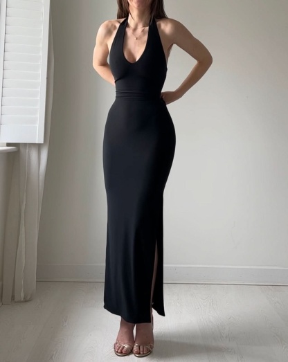 Black halter maxi dress with cinched waist and side slit