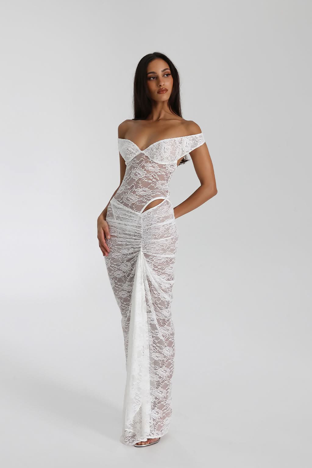 White lace maxi dress with off-shoulder wrap neckline and cutout details