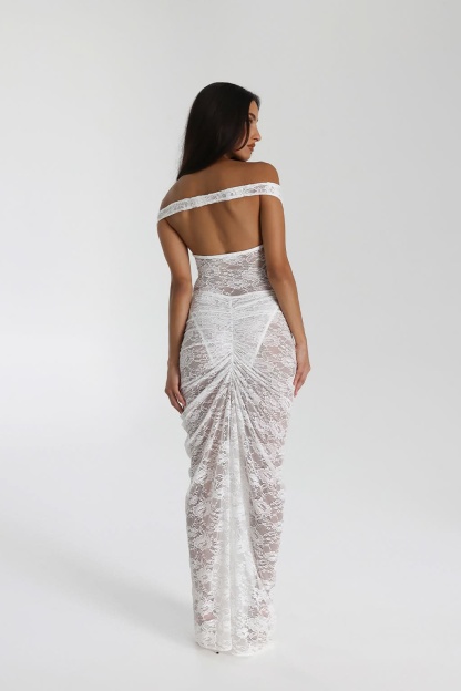 Back view of white lace maxi dress with open back and gathered ruched skirt