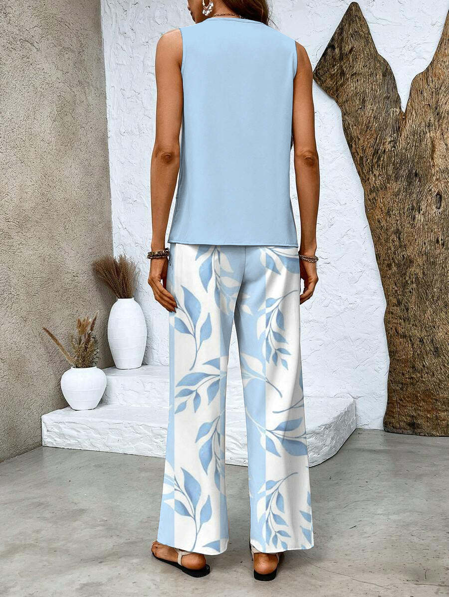 Back view of light blue sleeveless top with blue leaf print wide-leg pants
