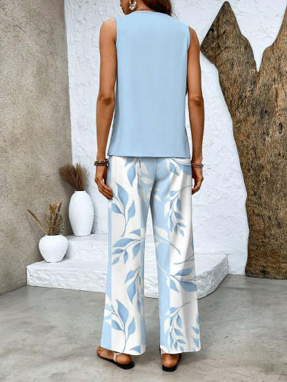 Back view of light blue sleeveless top with blue leaf print wide-leg pants