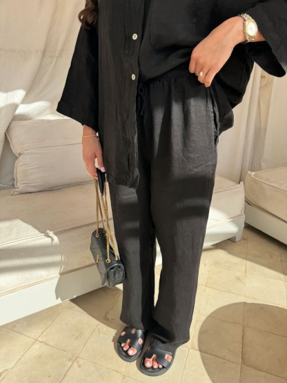 Black linen pants set with relaxed fit and button-up shirt