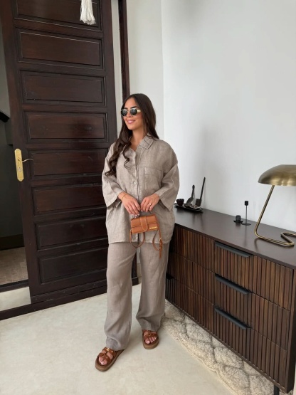 Taupe linen collared shirt paired with matching trousers