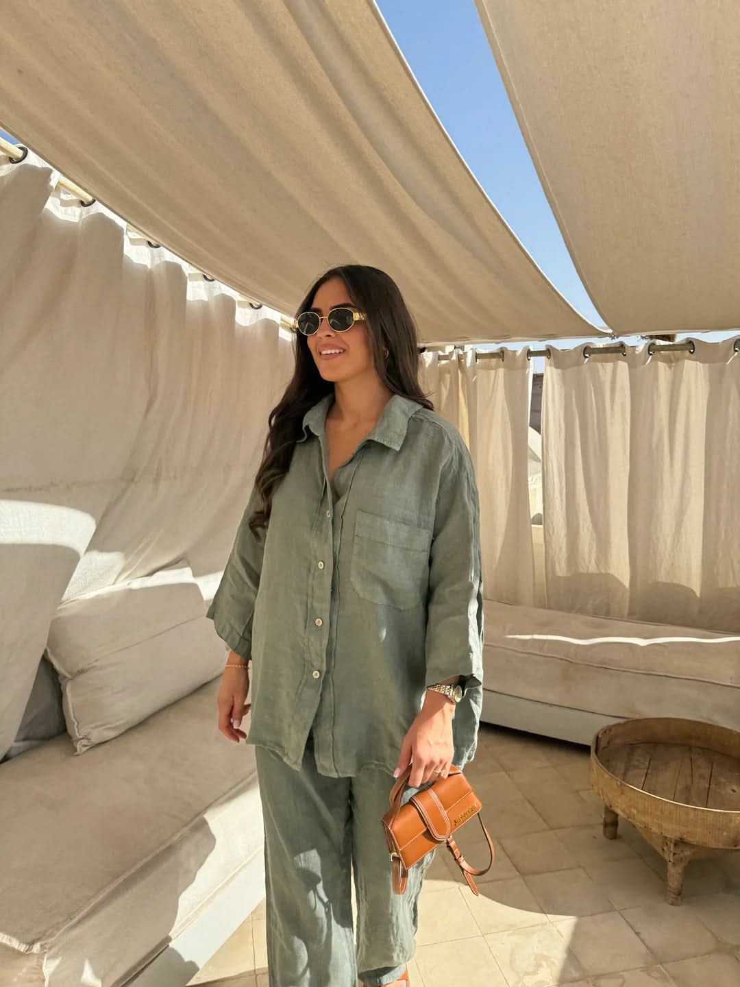Sage green linen shirt with pocket detail and wide-leg pants