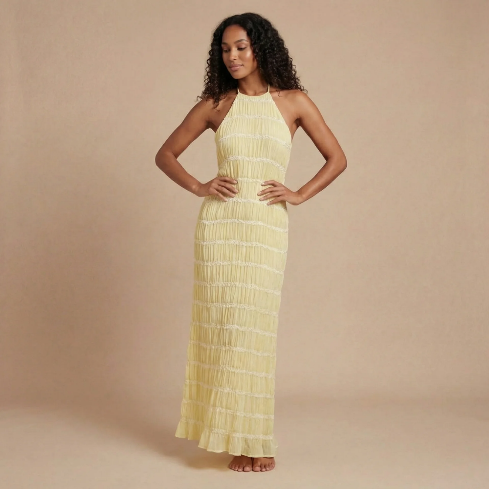 Soft yellow pleated halter maxi dress with elegant grid pattern for women