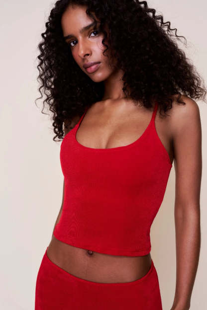 Close-up of red ribbed camisole top with scoop neckline and thin straps