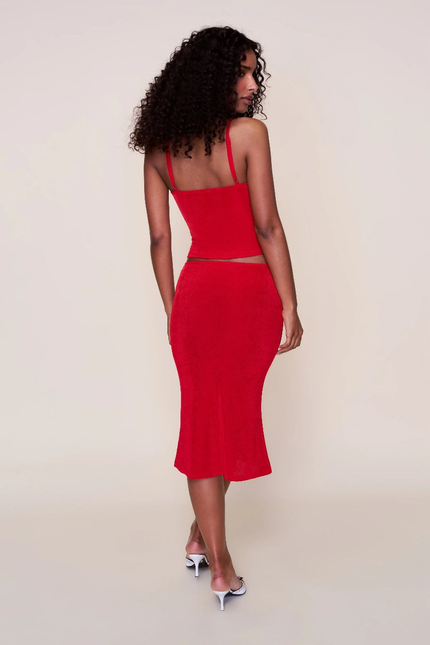 Back view of red ribbed midi set showing open back camisole design