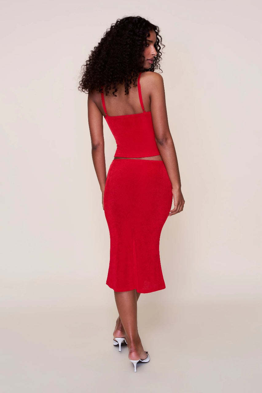 Back view of red ribbed midi set showing open back camisole design