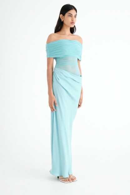 Side view of turquoise ruched maxi dress with off-shoulder neckline