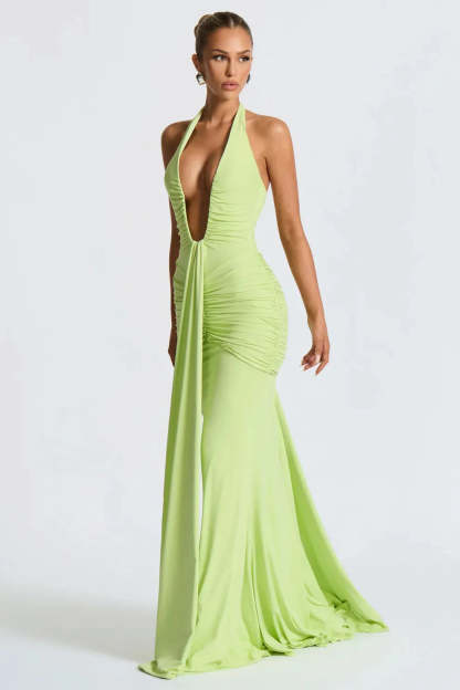 Lime green halter ruched maxi dress with deep V-neckline and flowing train
