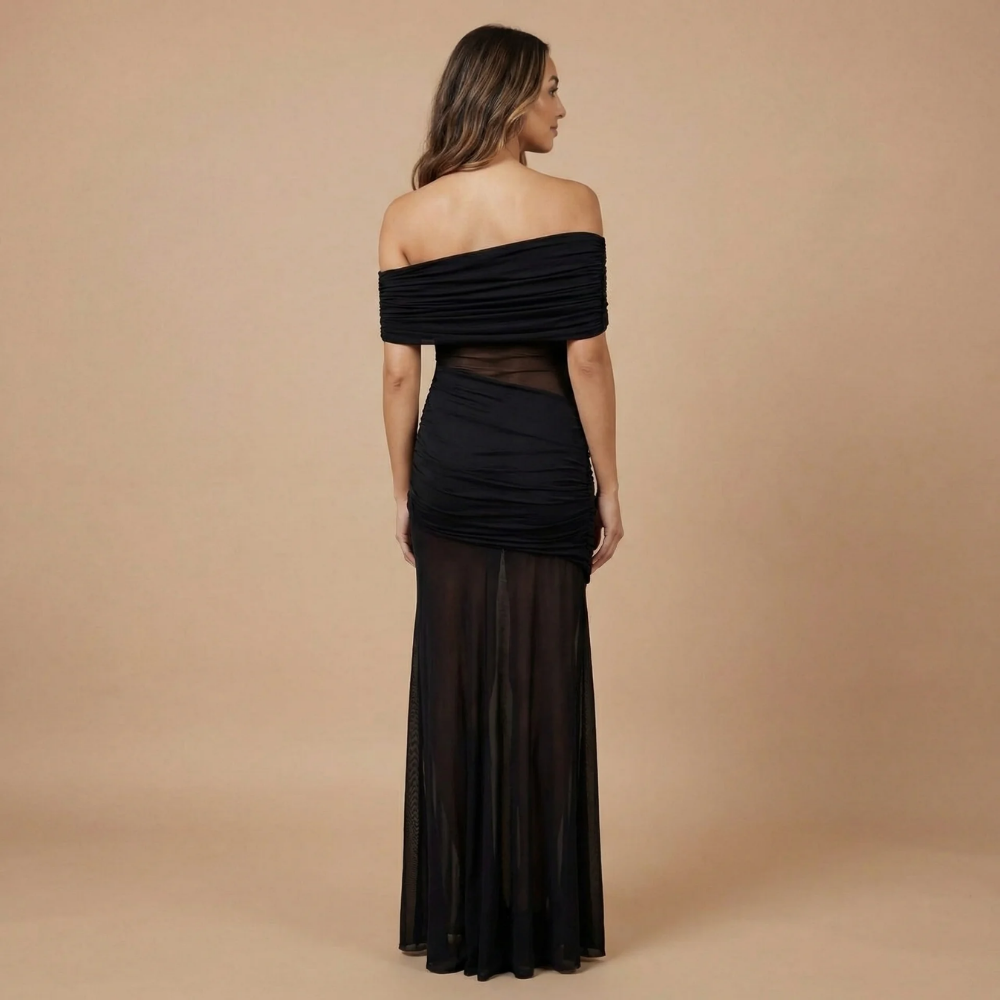 Black ruched off-shoulder maxi dress back view showing sheer mesh panel detail