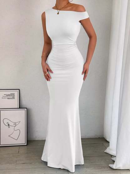 Back view of navy maxi dress showing ruched side seams and sleeveless cut