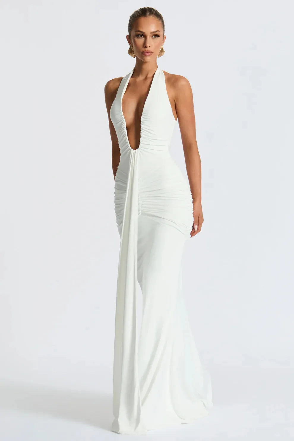 Ivory halter ruched maxi dress with plunging V-neckline and floor length