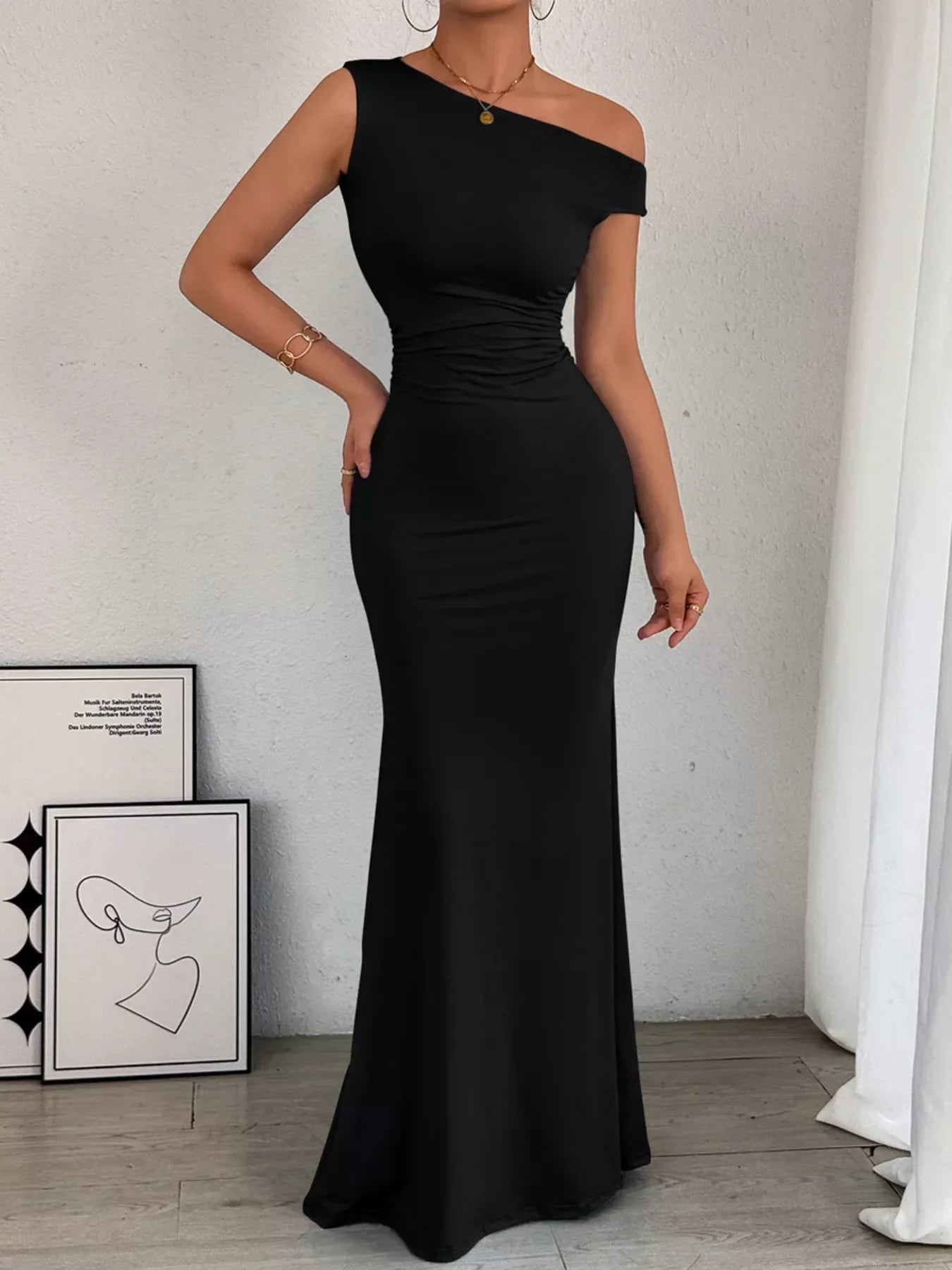 Black off-shoulder ruched maxi dress with asymmetrical neckline