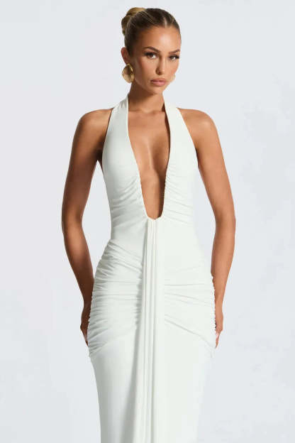 Front view of cream halter ruched maxi dress with draped bodice