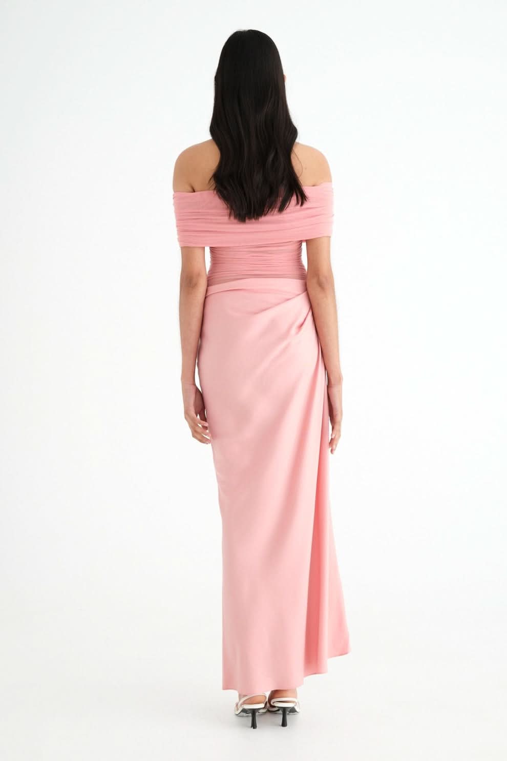 Back view of pink ruched maxi dress showing draped design