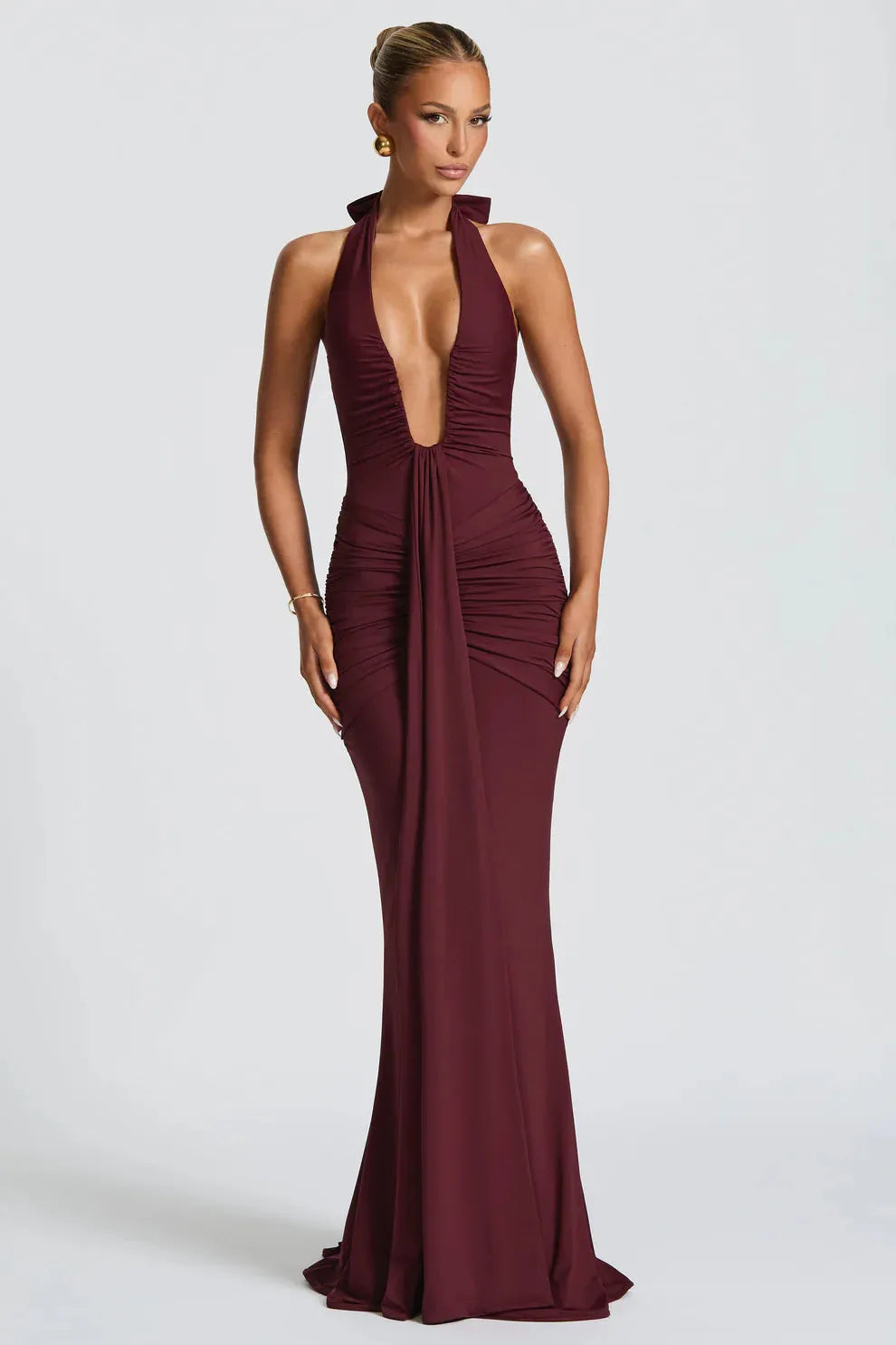 Burgundy halter ruched maxi dress with plunging neckline and mermaid silhouette