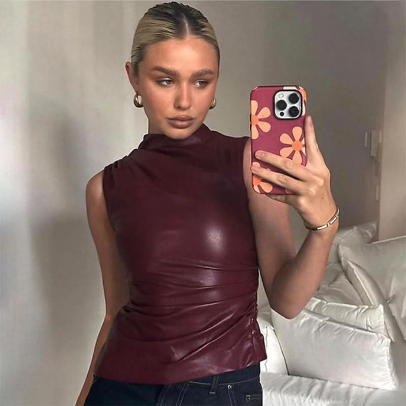 Burgundy faux leather ruched sleeveless top with mock neck on model for women