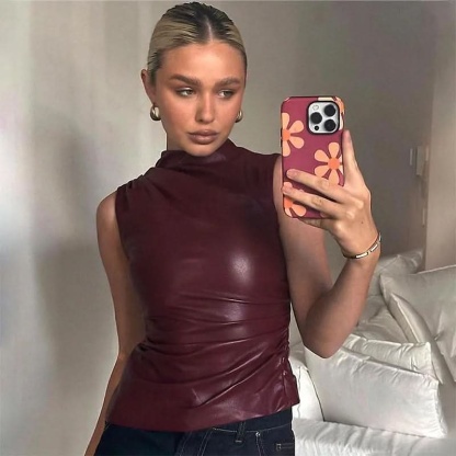 Burgundy faux leather ruched sleeveless top with mock neck on model for women