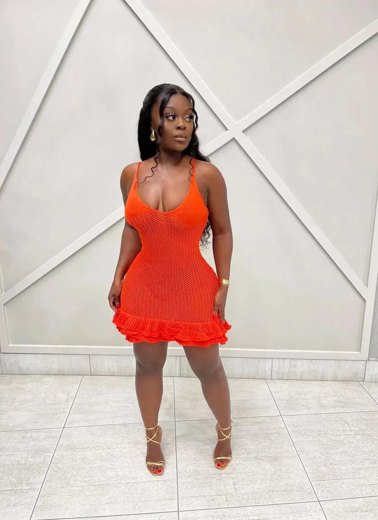 Coral red knit ruffle mini dress with scoop neck and layered hem