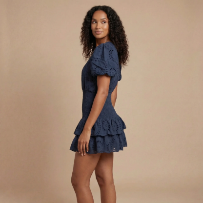 Navy tiered ruffle mini dress with eyelet embroidery and puff sleeves