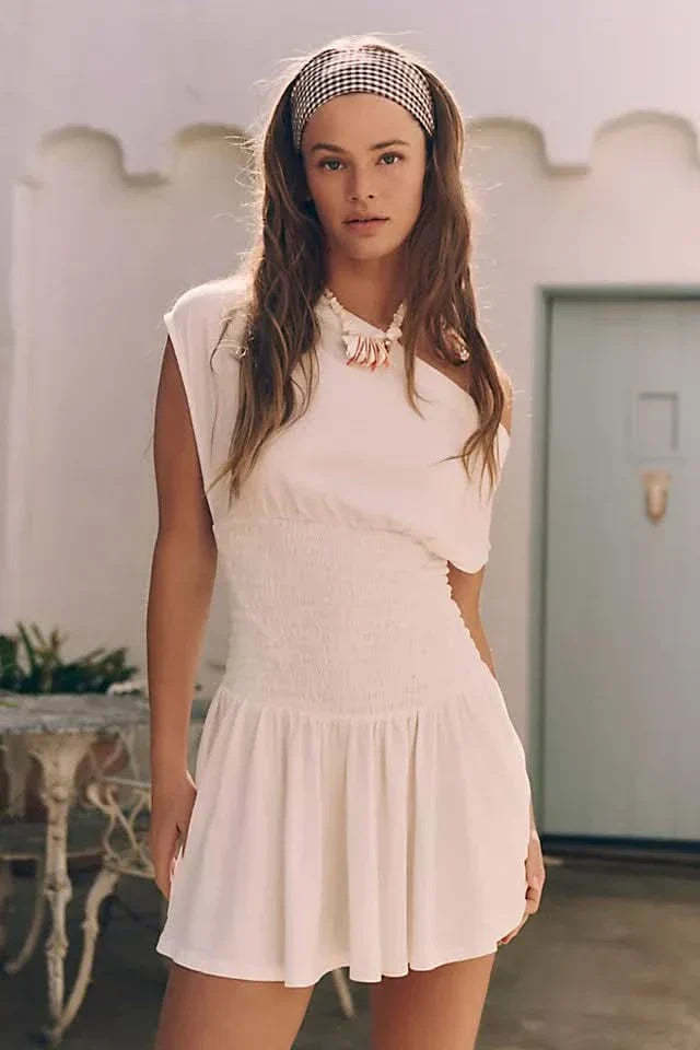 Cream off-shoulder ruffle mini dress with smocked waist and flared skirt