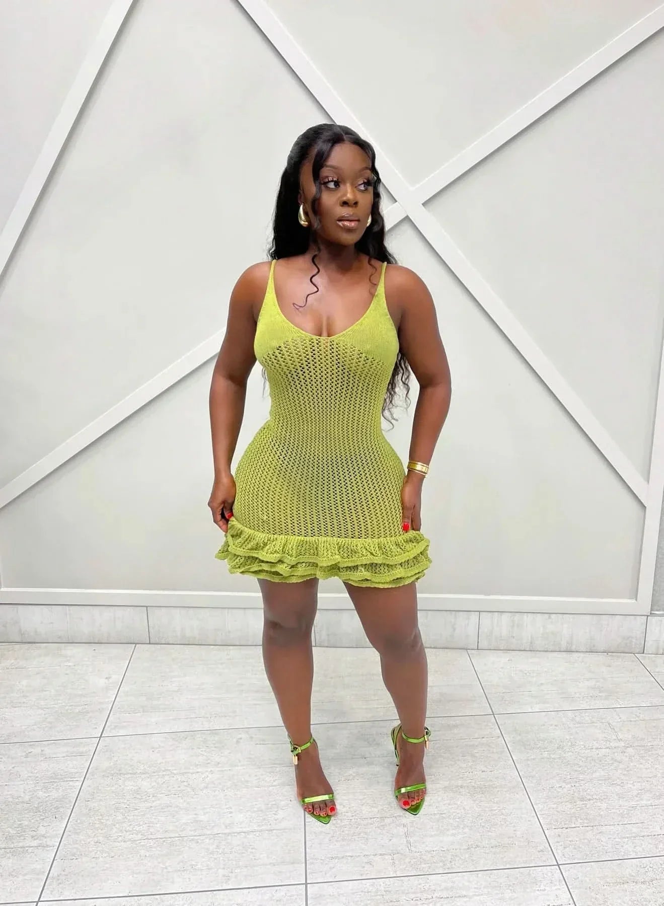 Lime green knit ruffle mini dress with textured crochet pattern