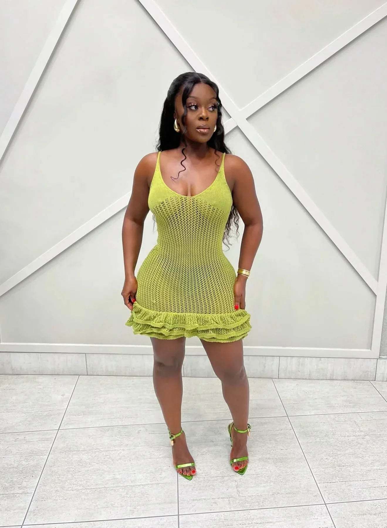 Lime green knit ruffle mini dress with textured crochet pattern