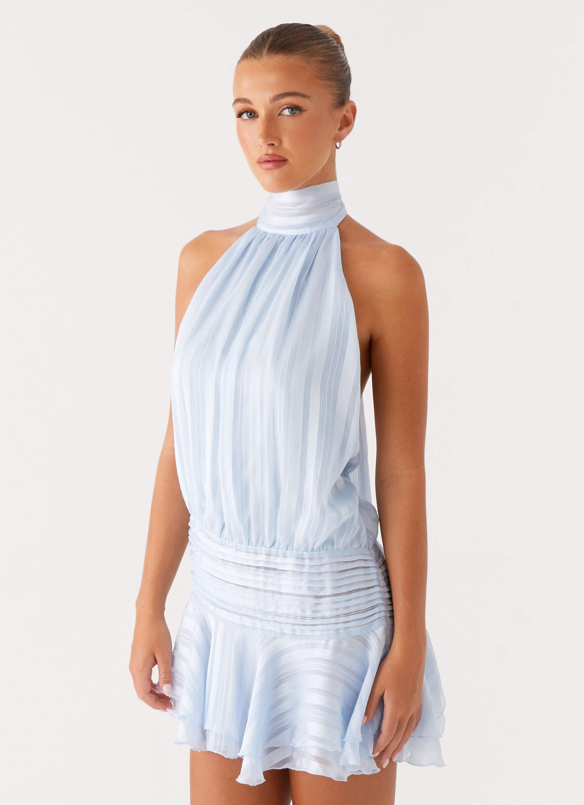 Light blue pleated halter mini dress back view showing open back design