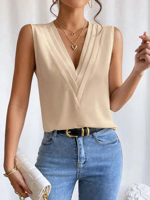 Beige wrap top with sleeveless design and layered crossover bodice