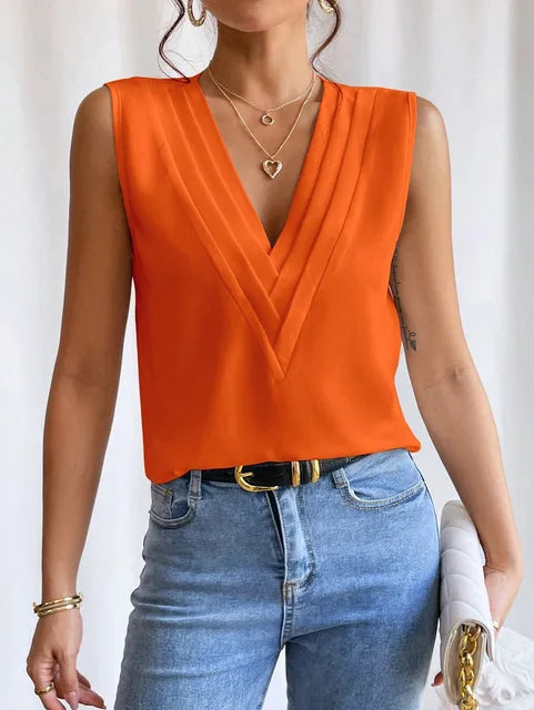 Black wrap vest top with deep V-neckline and draped layers