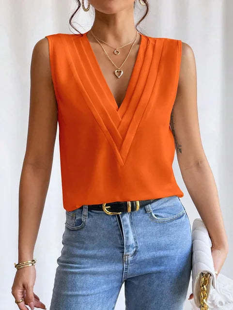 Black wrap vest top with deep V-neckline and draped layers