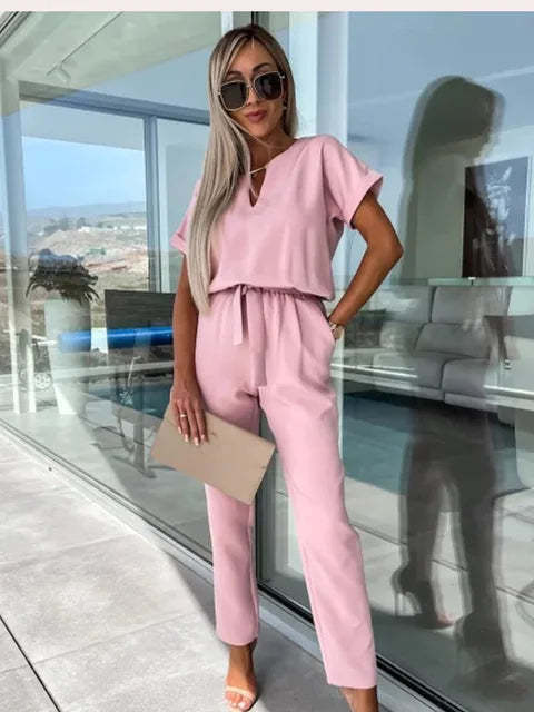 Pink keyhole wrap jumpsuit with short sleeves and drawstring waist