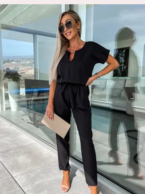 Black keyhole wrap jumpsuit with short sleeves and tapered ankle pants