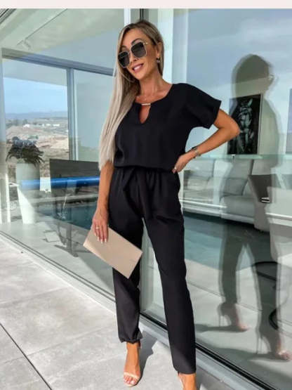 Black keyhole wrap jumpsuit with short sleeves and tapered ankle pants