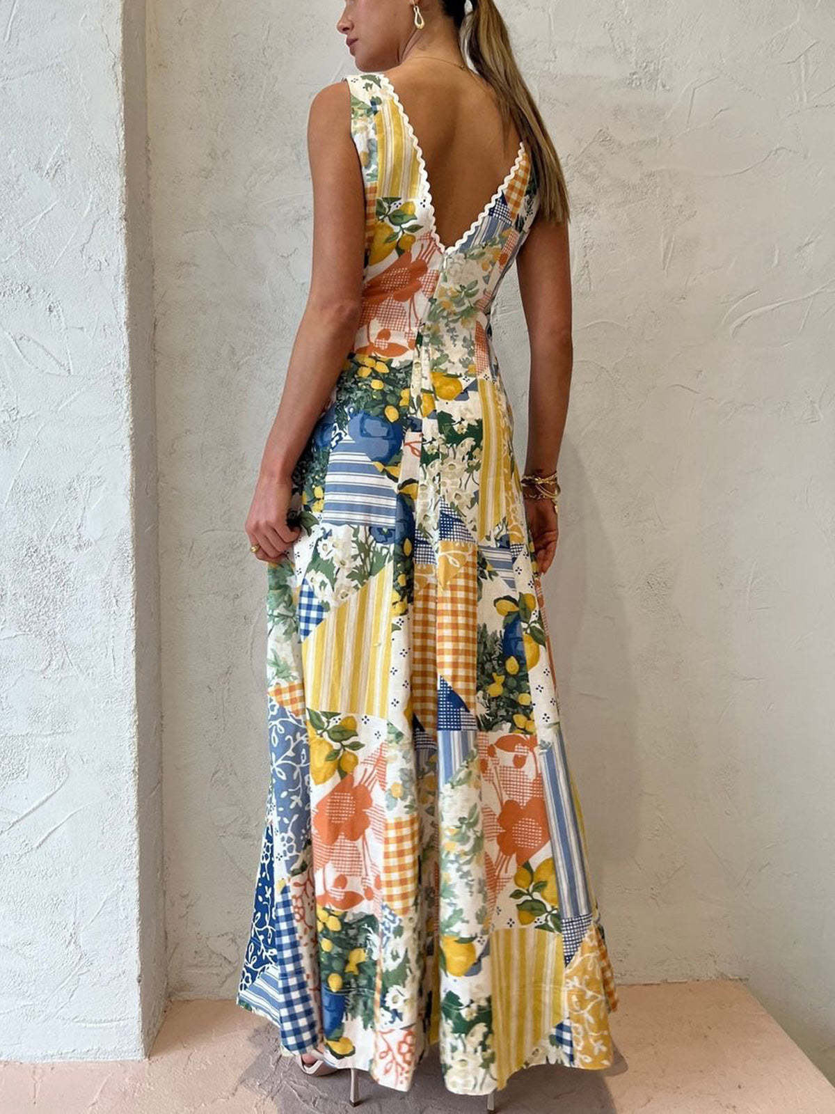 Patchwork maxi dress showing low V-back with scalloped trim and floral details for women