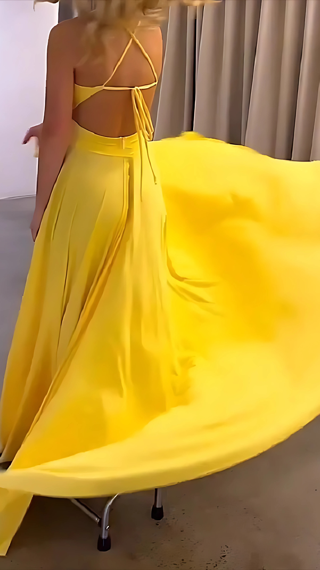 Back view of yellow maxi dress with tie-back detail