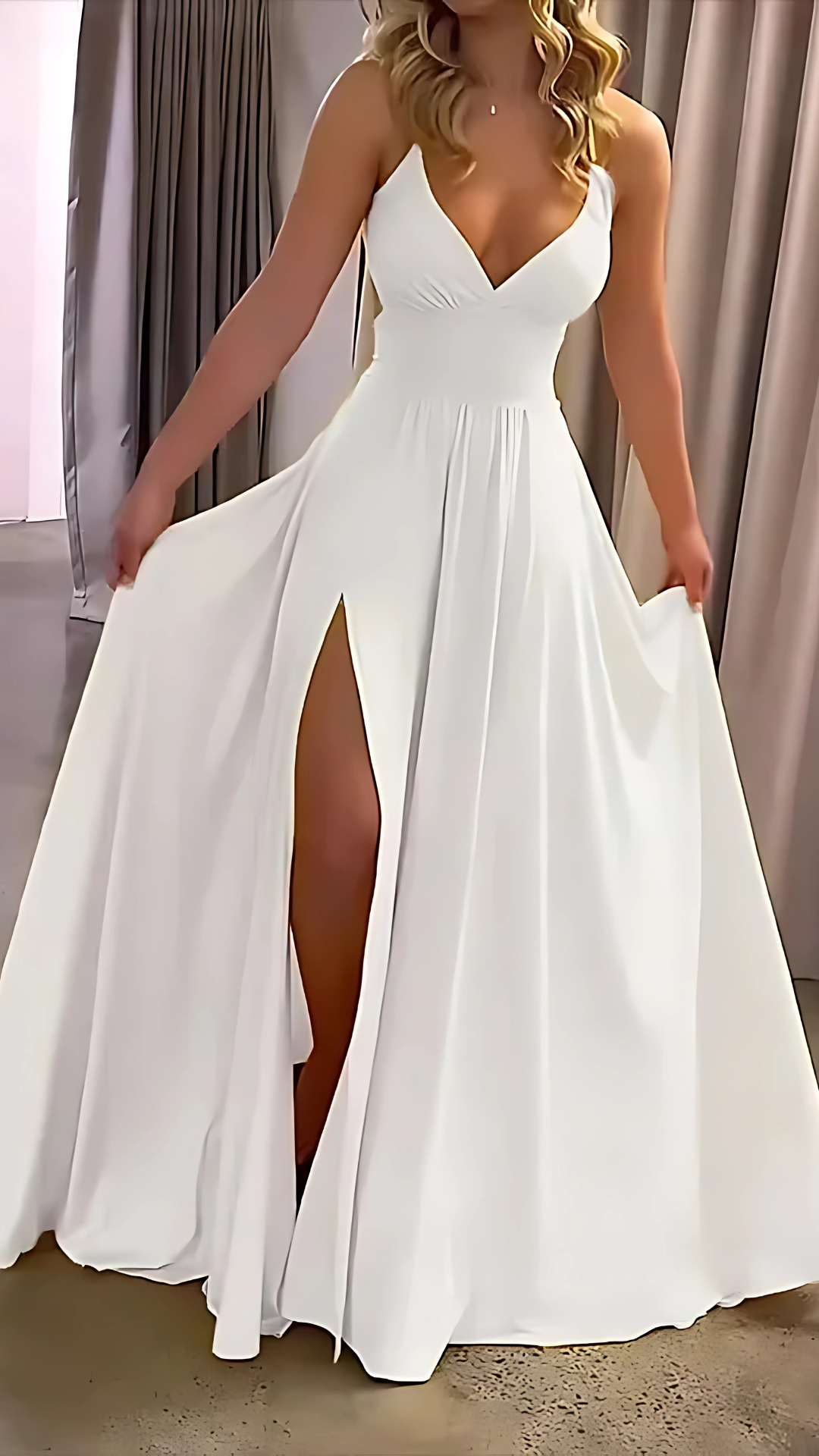 White slit maxi dress with V-neckline and draped skirt