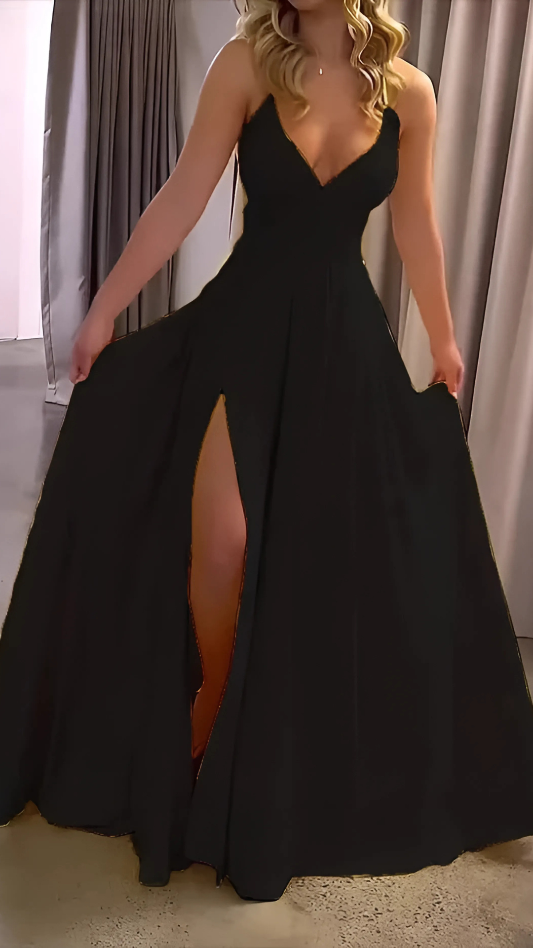 Black slit maxi dress with V-neckline and flowing train